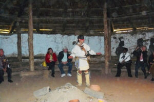 Historical Interpreter Scottie Ennis explains the Cherokee form of government at the Council House at the Ancient Village at the Cherokee Heritage Center