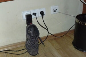 Electrical adapter propped up by a shoe